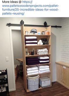 a closet with lots of folded towels and other items