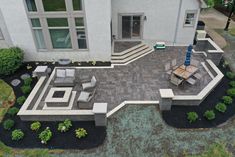 an aerial view of a patio and seating area in a home's front yard