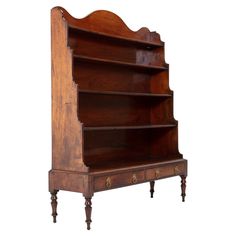 an old wooden bookcase with three shelves on one side and two drawers on the other