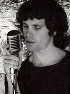 a man holding a microphone up to his face