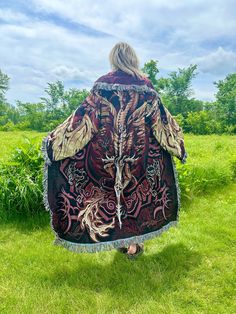 Introducing my latest creation! Upcycled two of the same tapestry blankets featuring artwork by Ruth Thompson to create this empowering, cozy, oversized dragon coat. Features two front pockets and toggle closure for added functionality. Perfect for breezy seaside mornings, late nights at festivals, movie dates, or lounging around the house. Sure to turn heads wherever you may wander! Measurements: Length is 57" Chest is 53" Shoulder to wrist is 25" Unisex design. Model is 5'10 for reference. 100% cotton. Very durable. Machine wash, tumble dry low. This statement jacket was made with all of my heart, for any human, anywhere, that may be attracted to its vibe! My intention is that the piece will amplify the divine nature of your inner being. ✨🌙 Dark Ages Clothing, Tapestry Clothes, Ruth Thompson, Tapestry Coat, Aged Clothing, Tapestry Blanket, Wardrobe Wishlist, Blanket Coat, Statement Jacket