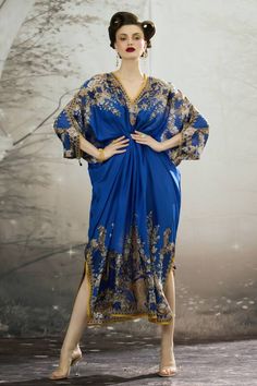 Blue silk kaftan with all over regal floral prints and narrow yellow panel work. - Aza Fashions Traditional Blue Floor-length Kaftan, Elegant V-neck Kaftan For Festivals, Traditional Blue Kaftan For Evening, Elegant Silk Kaftan For Festivals, Traditional Blue Evening Kaftan, Elegant Blue Kaftan For Festive Occasions, Royal Blue Long Kaftan, Blue Bollywood Style Abaya For Eid, Elegant Blue Floor-length Kaftan