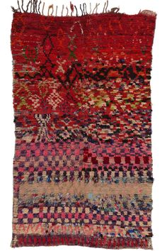 an old rug with many different colors and patterns