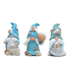 three small figurines in the shape of gnomes