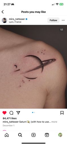 an image of a tattoo on the back of a woman's shoulder with scissors in it