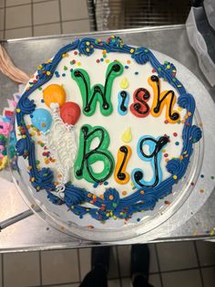 a birthday cake with the words wish big written on it