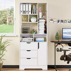 a desk with a computer on top of it next to a book shelf filled with books