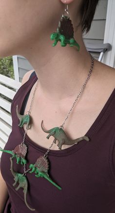 Toy dinosaurs turned fun jewelry! I saw an army of dinosaurs at a garage sale and felt a Ms. Frizzle moment come over me. I knew I needed to turn these toys into some Jurassic fun! These dinosaurs had a previous life as a toy and as such, they show some signs of wear. Not so much that it detracts from the whimsy or functionality of the earrings. If you have questions or concerns, please contact me BEFORE purchasing. Dino Necklace, Toy Dinosaurs, Ms Frizzle, Fun Jewelry, Garage Sale, Garage Sales, Previous Life, Dinosaurs, Amazing Jewelry