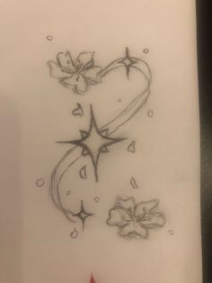 a drawing of a heart with flowers and stars in the middle on a piece of paper