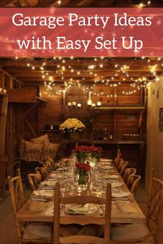 a table set up for a party with lights strung from the ceiling and flowers in vases