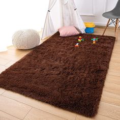 a teddy bear rug in the corner of a child's room with toys on the floor