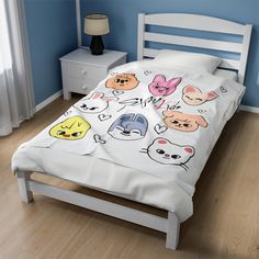 a bed in a room with blue walls and wooden floors, has an animal themed comforter on it