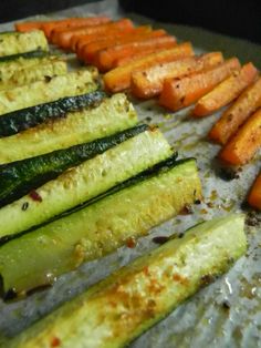 there are many different types of vegetables on the table together, including carrots and zucchini