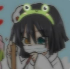 a girl with a face mask holding a baseball bat and wearing a green frog hat