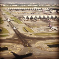 an airport with several planes parked on the tarmac