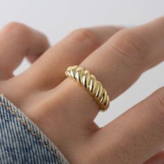 Trendy, and gorgeous croissant/dome ring is the perfect statement accessory! It's super high-quality and looks beautiful on. - - - D E T A I L S - - - * Made of 925 Sterling Silver * We use a THICK, DURABLE 14k Gold or Rhodium plating - for a piece that will last you years to come! * VERY HIGH QUALITY * Available in sizes 4-10 * Ring Width: 6mm * Nickel-Free & Hypoallergenic Ring Sizer- https://www.etsy.com/listing/1240904225/ring-sizer-reusable-ring-sizer-plastic?click_key=b5e074cfb419bcfddc2d9 Croissant Ring, Rope Ring, Twisted Ring, Rope Rings, Chunky Earrings, Chunky Ring, Dome Ring, Chunky Rings, Twist Ring