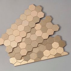 several wooden hexagons arranged on top of each other in the same pattern