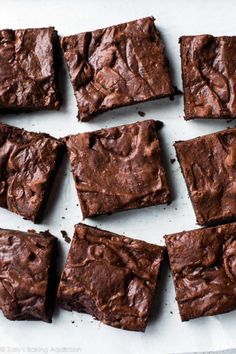 chocolate brownies cut into squares on a sheet of paper