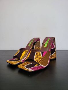 Bold lines, bright colours and a funky heel. This is Margaret's Mule. The shoe that turns heads and pulls compliments in abundance. Only FOUR pairs available!! Multicolor Casual Heels With Open Heel, Multicolor Sandals With Padded Block Heel, Multicolor Heels With Wooden Heel And Round Toe, Multicolor Block Heel Sandals With Padded Heel, Casual Multicolor Open Heel Shoes, Multicolor Heels With Wooden Heel For Summer, Colorful Casual High Heel Shoes, Trendy Multicolor Heels With Padded Heel, Multicolor Round Toe Heels With Sculpted Heel