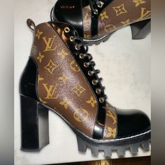 Authentic, Louis Vuitton Super Cute Ankle Boot. Retails For $1,790.00. I Have Only Worn These One Time! Excellent Condition! Comes With Box And Dust Bags For Each Boot! Shoes Star, Brown Heeled Boots, Cute Ankle Boots, Star Trails, Louis Vuitton Shoes, Authentic Louis Vuitton, Heeled Boots, Bootie Boots, Black And Brown