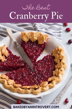 the best cranberry pie is on a plate with a knife