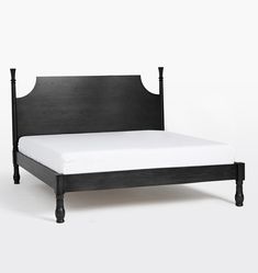 a black bed frame with white sheets and headboard on the bottom side, in front of a white background