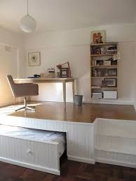 an empty room with a desk, chair and bookshelf on the wall next to it