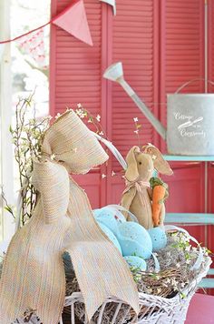 a basket filled with stuffed animals sitting on top of a table