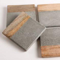 four square concrete coasters with wood accents