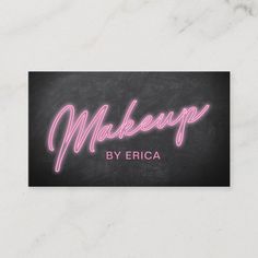 makeup business card with the word makeup written in pink neon lights on a black background