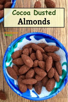 Blue bowl of cocoa dusted almonds on wooden board Cocoa Dusted Almonds, Cocoa Almonds Recipe, January Whole30, Coated Almonds, Homemade Dark Chocolate