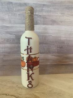 a bottle that has some kind of type of decoration on the top of it,