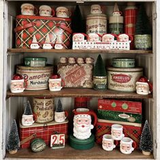 an old wooden shelf filled with christmas items