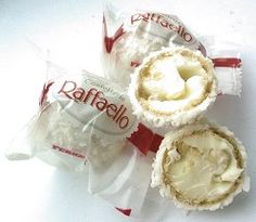 three rolls wrapped in white paper and sitting on top of each other with the word raffaello printed on them