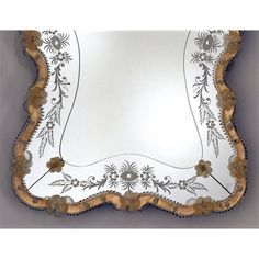 a decorative mirror hanging on the wall