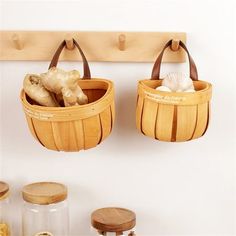 two wooden baskets hanging on a wall