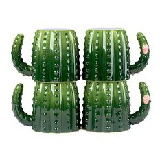 three green cactus mugs sitting next to each other