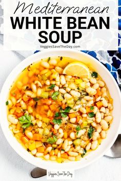 white bean soup in a bowl with lemon wedges on the side