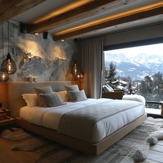 a large bed sitting in the middle of a bedroom next to a window with mountains in the background