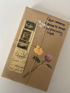 an old book with stamps and flowers on it