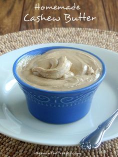 homemade cashew butter in a blue bowl on a white plate