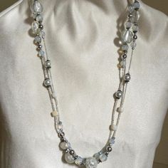 A Beautiful 32 Inches Necklace That Can Be Double Or Triple Wrap Around The Neck For A Different Look Each Time. It Has Clear, Silver, White And Translucent Beads Of All Different Sizes. In Great Vintage Condition. White Necklaces With Colorful Beads For Party, Elegant White Multi-strand Long Necklace, Elegant White Double Strand Long Necklace, White Beaded Necklaces With Silver Beads, Elegant White Beaded Necklaces With Large Beads, Elegant White Beaded Necklaces With Colorful Beads, Elegant White Spacer Beads, Elegant White Beaded Necklace With Large Beads, Elegant White Beaded Necklace With Colorful Beads