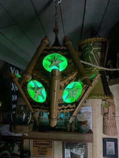 a clock with green lights hanging from it's sides