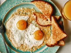 two fried eggs and toast on a plate