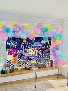 a birthday party with balloons and streamers in the shape of an 80s's theme