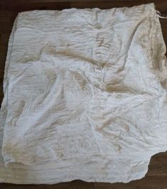 an old white blanket on the floor