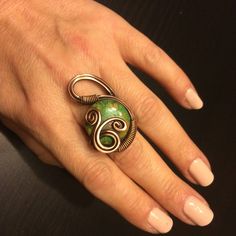 This green jasper ring it bring you good luck and I hope you enjoy it for years to come. You will feel beautiful, amazing and perfect. Because these are the most often used adjectives from thousands of happy customers. This wire wrapped ring,is basically adjustable and will fit just about any size. My copper ring is sized to fit most fingers but custom redesign sizing can be done to ensure a comfortable fit for larger or for petite wrist. Adjustable fit by bending the ring. But if your finger is Earthy Green Wire Wrapped Jewelry, Unique Green Copper Ring, Unique Green Copper Rings, Unique Green Wire Wrapped Rings, Green Copper Rings As Gifts, Copper Wire Jewelry, Ring Wire, Jasper Ring, Wire Wrapped Ring