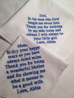 two handkerchiefs with embroidered words on them