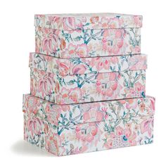 three floral boxes stacked on top of each other