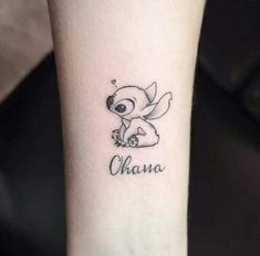 a small tattoo on the wrist that says ohana